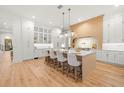 Spacious kitchen with white and light wood cabinets, and a large island at 3011 W Asbury Pl, Tampa, FL 33611