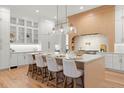 Spacious kitchen with white and light wood cabinets, and a large island at 3011 W Asbury Pl, Tampa, FL 33611
