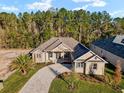 Single-Gathering home with a large backyard and tree coverage at 5034 Elm Leaf Dr, Brooksville, FL 34601