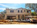 Two-story house under construction; framing complete, showing the structure's size and layout at 3416 W Barcelona St, Tampa, FL 33629