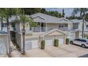 Three-unit building with attached garages and balconies at 1817 Hammocks Ave # 1817, Lutz, FL 33549