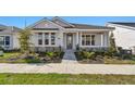 Inviting single-story home with manicured landscaping and a paved walkway leading to the front door at 683 Allora Ave, Nokomis, FL 34275