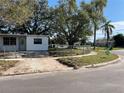 Front view of a single story house with a yard at 1716 Lancelot Loop, Tampa, FL 33619