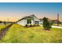 Landscaped lawn with a view of the home's exterior at 6907 162Nd E Pl, Parrish, FL 34219