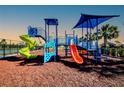 Colorful playground with slides, climbing structures, and shade coverings at 7030 162Nd E Pl, Parrish, FL 34219