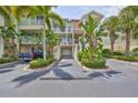 Two-story townhome with attached garage and lush landscaping at 3226 Mangrove Point Dr, Ruskin, FL 33570