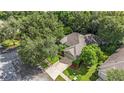 Bird's-eye view of a single story house and surrounding neighborhood at 811 Woodcarver Ln, Brandon, FL 33510