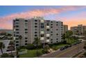 Luxury condo building at sunset, offering breathtaking views at 851 Bayway Blvd # 104, Clearwater Beach, FL 33767