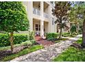 Inviting home exterior with well-manicured landscaping and a charming front porch at 6002 Printery St # 103, Tampa, FL 33616