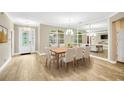 Bright dining room with a large table and mirror wall at 806 Red Ash Ct, Seffner, FL 33584