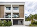 Contemporary two-story townhome with private balcony and driveway at 2506 N Highland Ave, Tampa, FL 33602