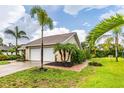 White garage door and brick paver walkway at 1501 63Rd W St, Bradenton, FL 34209