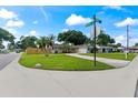Front yard view of charming ranch home with street view at 8402 Bedford Ln, Tampa, FL 33615