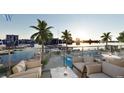 Waterfront patio with lounge seating and city views at 411 E Shore Drive # 705, Clearwater Beach, FL 33767