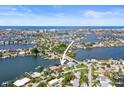 Wide aerial showcasing the property's waterfront location and neighborhood at 613 79Th S Cir, St Petersburg, FL 33707