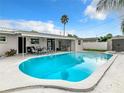 Relaxing kidney-shaped pool, perfect for outdoor enjoyment at 504 Florida S Cir, Apollo Beach, FL 33572