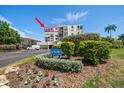 Condo building exterior showcasing a desirable waterfront location and landscaping at 6218 Palma Del Mar S Blvd # 606, St Petersburg, FL 33715