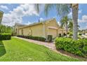 House exterior showcasing landscaping and brick walkway at 806 Chipper Dr, Sun City Center, FL 33573