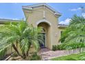 Front entrance with purple door and brick walkway at 806 Chipper Dr, Sun City Center, FL 33573