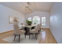 Elegant dining room with hardwood floors and a stunning chandelier at 10922 Brucehaven Dr, Riverview, FL 33578