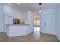 Kitchen features a breakfast bar and stainless steel appliances at 10922 Brucehaven Dr, Riverview, FL 33578