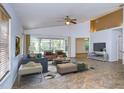 Bright living room featuring tile floors and sliding glass doors leading to the backyard at 10922 Brucehaven Dr, Riverview, FL 33578