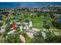 Stunning aerial view of a golf course community with lush greenery and beautiful water views at 2156 Masters Ct # 2156, Dunedin, FL 34698