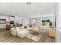 Bright and spacious living room with open floor plan and access to backyard at 1692 Fallon Pass, Zephyrhills, FL 33541