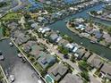 Aerial view of a waterfront community with houses and canals at 415 Islebay Dr, Apollo Beach, FL 33572