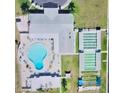 Community features a kidney shaped pool, tennis courts, and clubhouse at 15 Hamilton Ln # 7, Palm Harbor, FL 34684