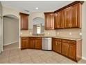 Kitchen boasts stainless steel appliances, granite countertops, and ample cabinet space at 7806 Grasmere Dr, Land O Lakes, FL 34637
