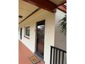 Exterior view of condo building, showing building number and entrance at 10369 Paradise Blvd # 58, Treasure Island, FL 33706