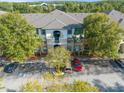 Exterior view of a two-story building with parking at 17104 Carrington Park Dr # 520, Tampa, FL 33647