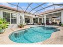Inviting pool and spa area with covered patio at 8432 Dunham Station Dr, Tampa, FL 33647