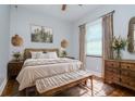 Comfortable bedroom with a rustic decor and natural light from the window at 803 W Sligh Ave, Tampa, FL 33604