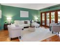 Spacious living room featuring a neutral color palette and hardwood floors at 12917 Rain Forest St, Temple Terrace, FL 33617