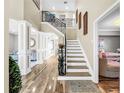 Elegant entryway with a grand staircase and hardwood floors at 12506 Ashdown Dr, Odessa, FL 33556