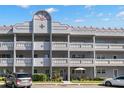 Two-story building exterior with balconies and parking at 2295 Americus E Blvd # 27, Clearwater, FL 33763