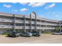 Building exterior showcasing multiple units and parking at 2295 Americus E Blvd # 27, Clearwater, FL 33763