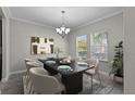 Dining room with a modern table and chairs, and light walls at 3147 Calvano Dr, Land O Lakes, FL 34639