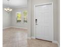 Bright entryway with tile flooring and neutral walls at 3147 Calvano Dr, Land O Lakes, FL 34639