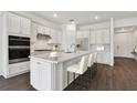 Modern kitchen with stainless steel appliances and an island at 1686 Fallon Pass, Zephyrhills, FL 33541