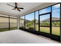 Spacious screened patio with backyard view at 5607 Limelight Dr, Apollo Beach, FL 33572