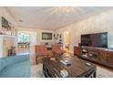 Living room features hardwood floors and fireplace at 2367 Woodlawn W Cir, St Petersburg, FL 33704