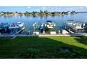 Private boat dock on the bay with a lift, providing quick ocean access and picturesque waterfront views at 9495 Blind Pass Rd # 206, St Pete Beach, FL 33706