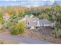 Aerial view of two-story house nestled in lush greenery at 17307 Linda Vista Cir, Lutz, FL 33548