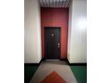 Apartment building hallway with access door at 2410 W Azeele St # 212, Tampa, FL 33609