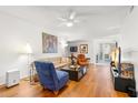 Spacious living room featuring hardwood floors and ample natural light at 10823 Indian Hills Ct # 32, Seminole, FL 33777
