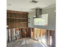 Kitchen under renovation with new wood shelving at 3616 Alabama Ne Ave, St Petersburg, FL 33703