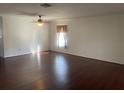 Spacious living room features hardwood floors, white walls, and natural light at 423 Chimney Rock Dr, Ruskin, FL 33570